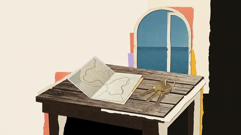 A paper map and three brass keys lie on a cafe table by a window overlooking water.