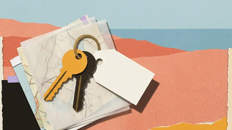 Brass keys and a blank luggage tag resting on folded maps against a textured backdrop.